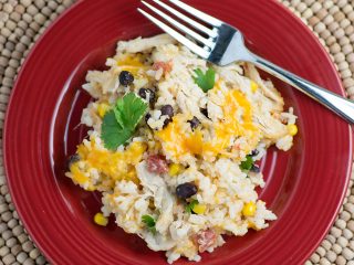 Cheesy Rice, Chicken and Bean Bake - An easy meal packed with flavors! Moist chicken, salsa, gooey cheese, beans and tender rice will please any family!