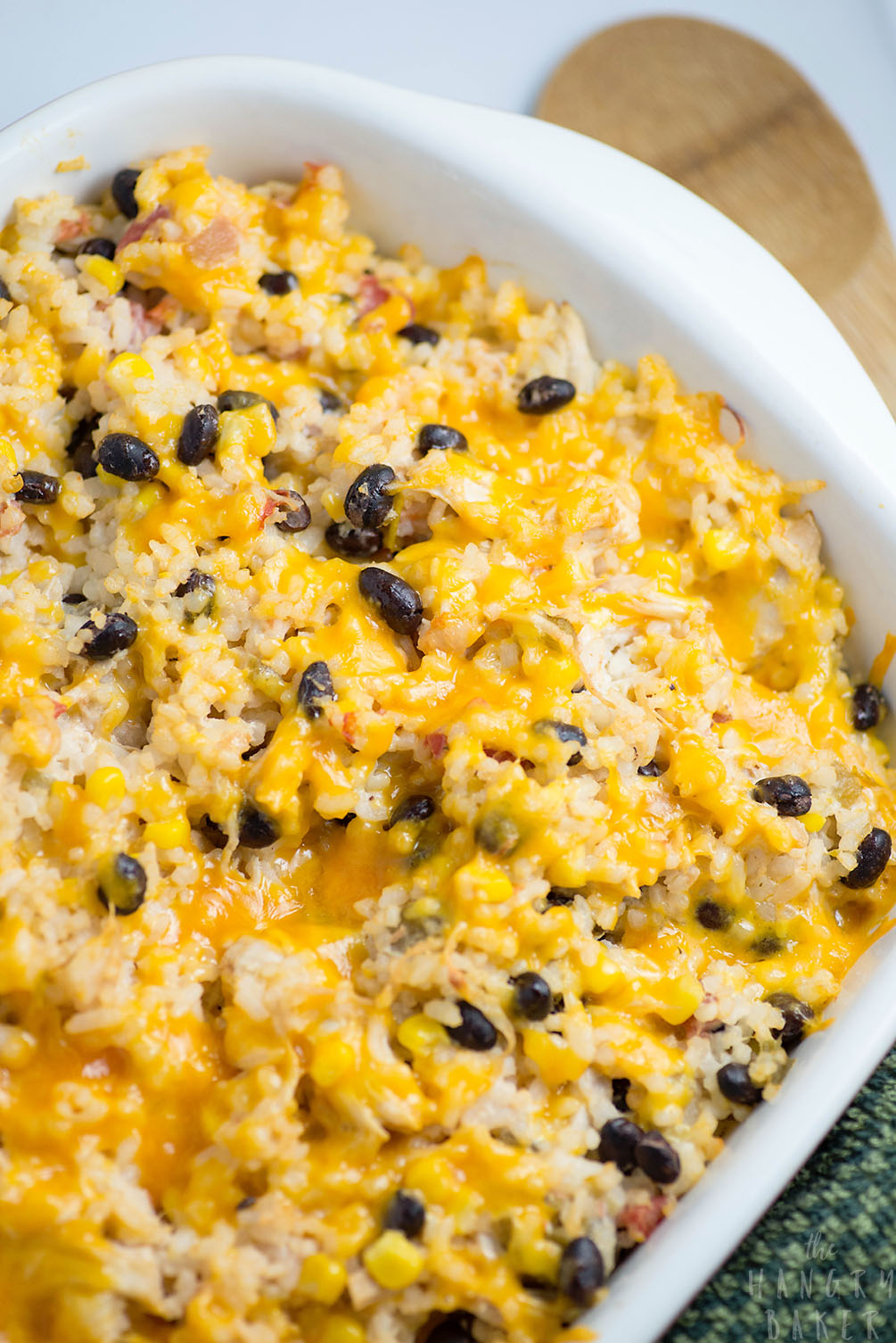 Cheesy Rice, Chicken and Bean Bake - An easy meal packed with flavors! Moist chicken, salsa, gooey cheese, beans and tender rice will please any family!