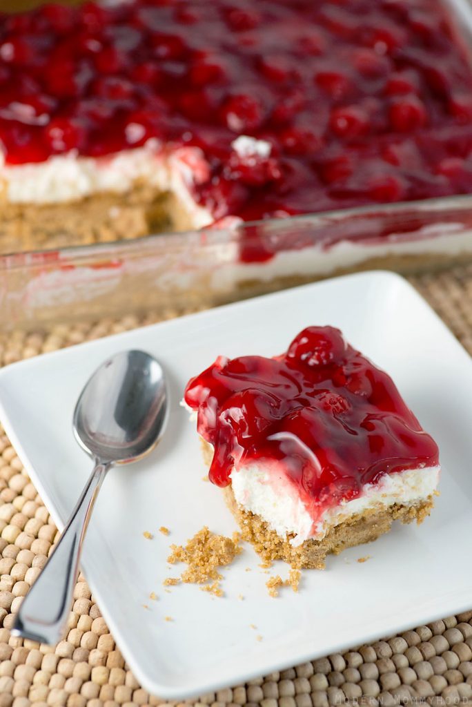 Cherry Delight - a yummy graham cracker crust with a middle layer of homemade whipped filling, all topped with a delicious layer of cherries!
