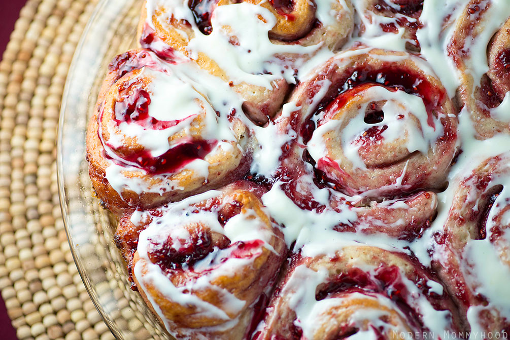 Sticky Jam Sweet Rolls Recipe- a homemade treat better than anything store-bought! An easy sweet dough recipe + any fruity jam of your choosing + topped with cream cheese icing = perfection!