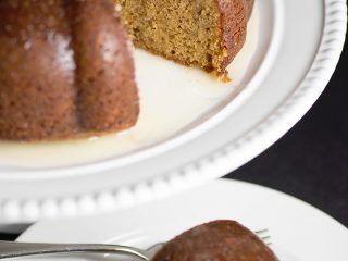 White Wine Cake - This super moist cake tastes exactly like a glazed donut! A warm buttery glaze tops this deliciously soft and addictive cake!