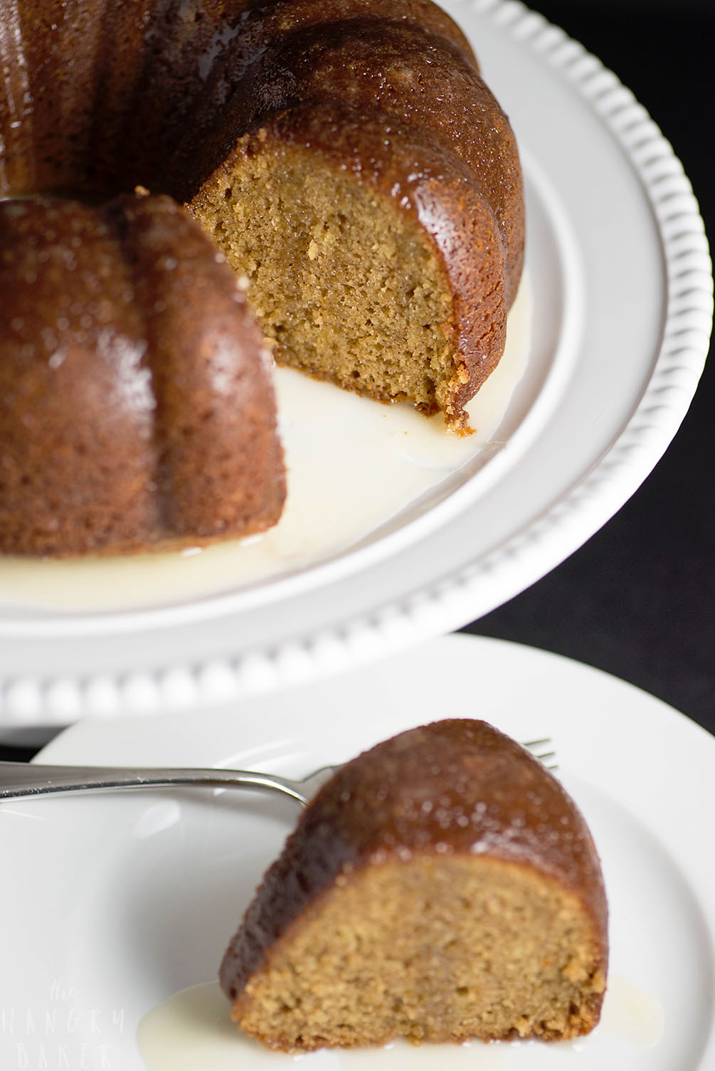 White Wine Cake - This super moist cake tastes exactly like a glazed donut! A warm buttery glaze tops this deliciously soft and addictive cake!