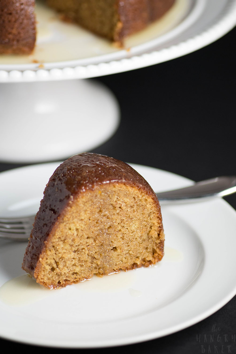 White Wine Cake - This super moist cake tastes exactly like a glazed donut! A warm buttery glaze tops this deliciously soft and addictive cake!