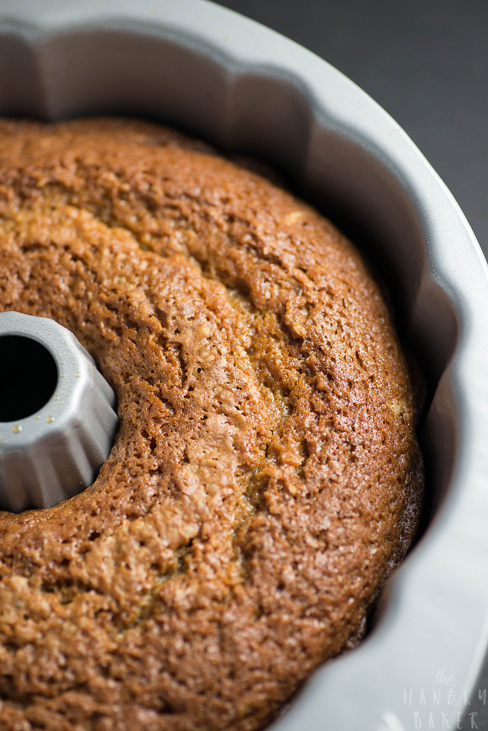 White Wine Cake - This super moist cake tastes exactly like a glazed donut! A warm buttery glaze tops this deliciously soft and addictive cake!