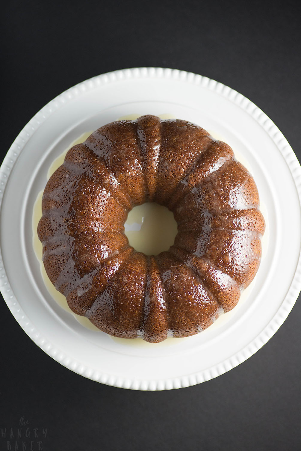 White Wine Cake - This super moist cake tastes exactly like a glazed donut! A warm buttery glaze tops this deliciously soft and addictive cake!