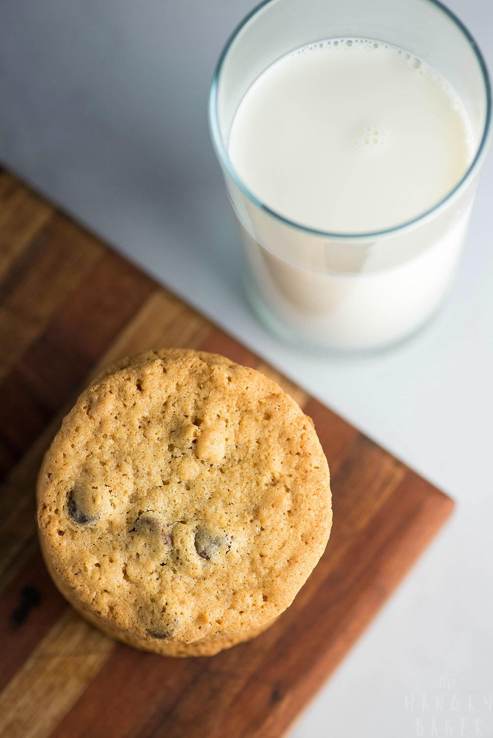 Crunchy and Chewy Chocolate Chip Cookies - the perfect balance of crunchy AND chewy! These thinner chocolate chip cookies are super addictive!