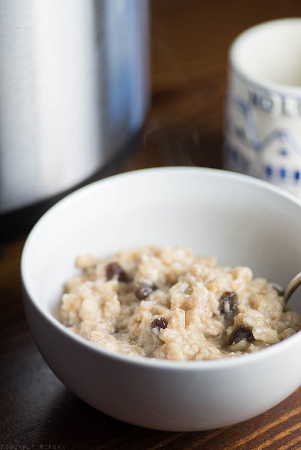 Overnight Cinnamon Raisin Oatmeal - A deliciously warm and hearty breakfast, perfect for fall and winter! With the perfect amount of cinnamon, brown sugar and raisins, this hot cereal is a great way to start your day! It's made in a rice cooker too!