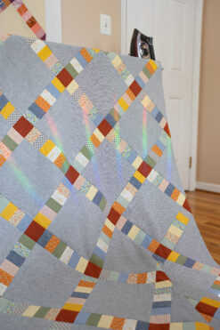 Simply Scraps quilt top in homespun blue and folksy colors.