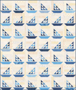 A scrappy sailboat quilt pattern and various blue fabrics. Boats alternate directions by lines.